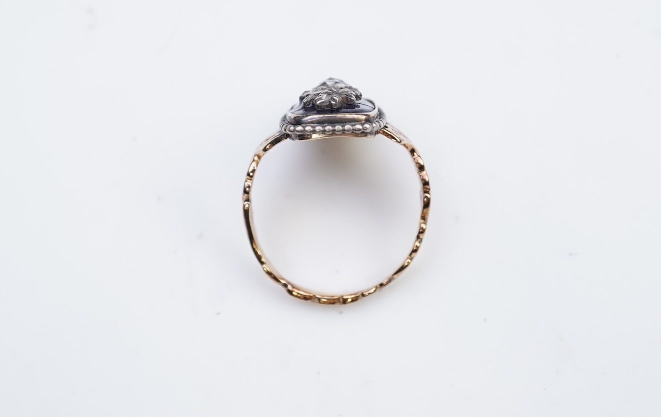 A diamond and blue glass ring